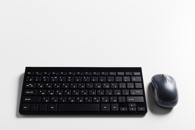 Keyboard and mouse on the table .