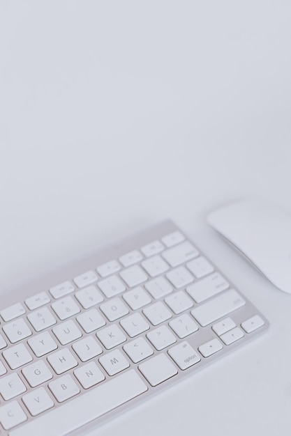 Keyboard and mouse on white background with copy space Minimalist wallpaper for business