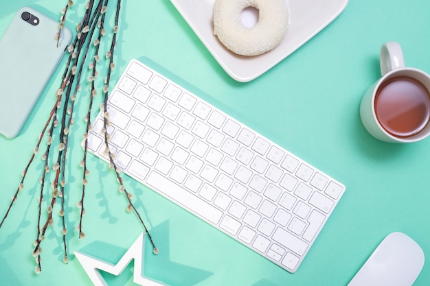 keyboard, phone, tea, donut and willow branch