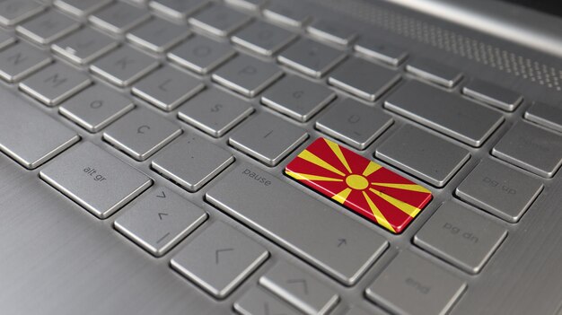 Фото keyboard with macedonia flag on the enter button represents cyber attack learning language