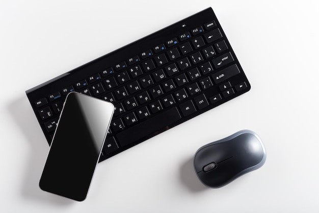 Keyboard with mobile phone on the table