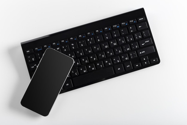 Keyboard with mobile phone on the table