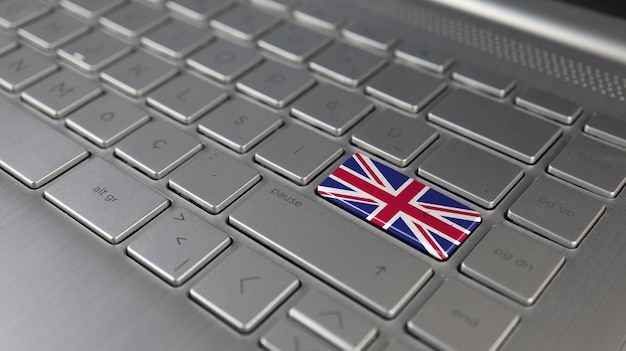 Keyboard with United Kingdom flag on the enter button represents cyber attack learning language