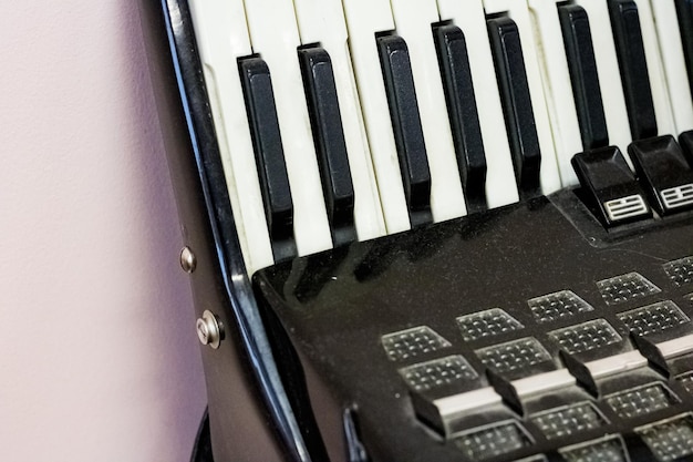 Photo keys of a black old accordion closeup