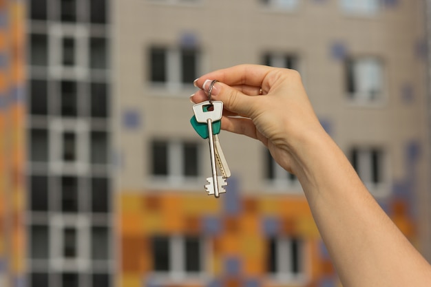 Keys close-up of new apartment, blurred background