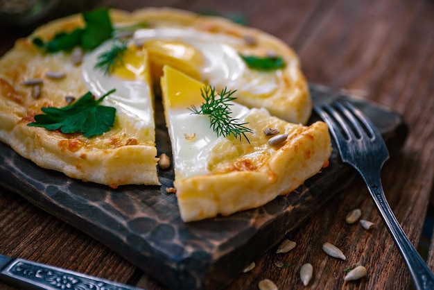 Khachapuri from rice flour cottage cheese dough with egg and mozzarella cheese