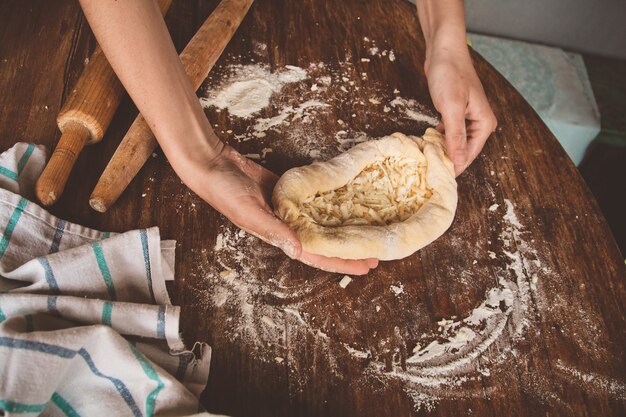 Khachapuri with cheese is molded 