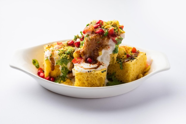 Photo khaman dhokla chaat is a very simple and refreshing fusion chaat recipe made using leftover dhokla