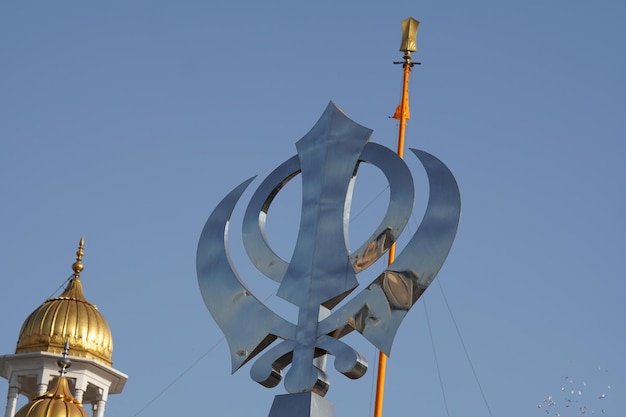 Photo the khanda the symbol of the sikh faith which attained its current form around the 1930s