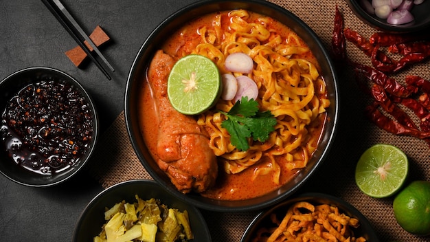 Khao soi kai or khao soi gai northern thai cuisine egg noodles with spicy yellow curry and chicken