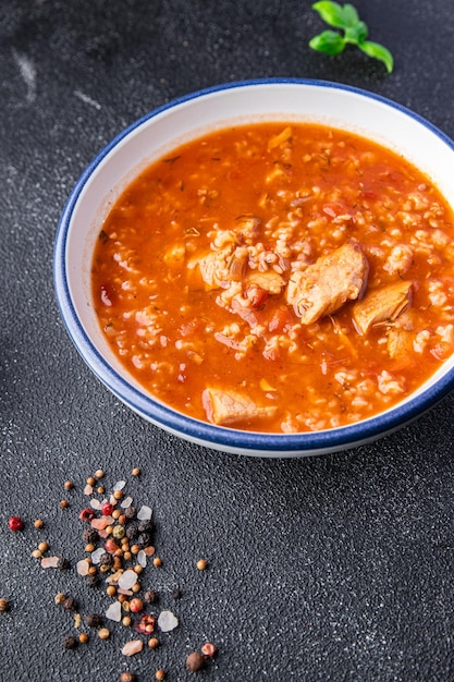 kharcho red tomato soup meat, rice meal food snack on the table copy space food background