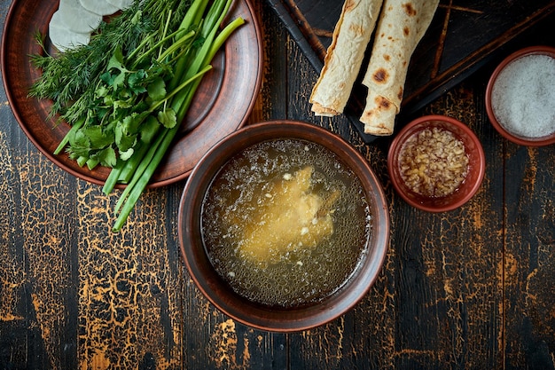 Khash dish of boiled cow or sheep parts which might include the head feet and stomach Soup hash in bowl