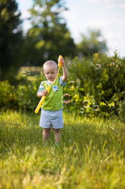 Kid blowing soap bubbles