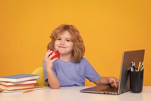 Kid boy from elementary school with book Little student smart nerd pupil ready to study Concept of education and learning