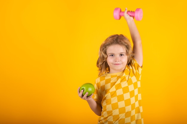 Kid boy working out with dumbbells Sport and kids training