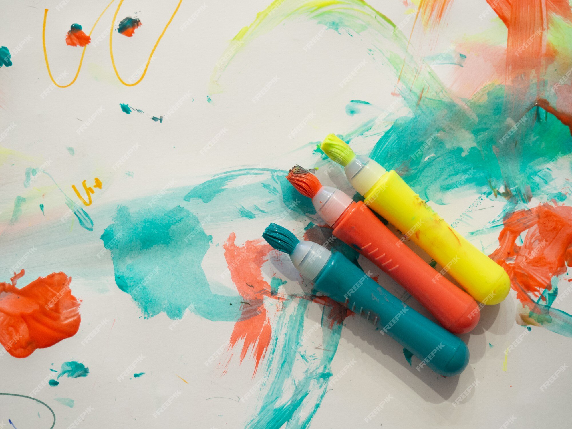 Premium Photo | Kid colored markers with brush stroke lines on painted  white paper background macro selective focus