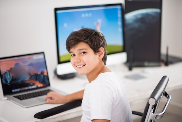 Kid on computer working