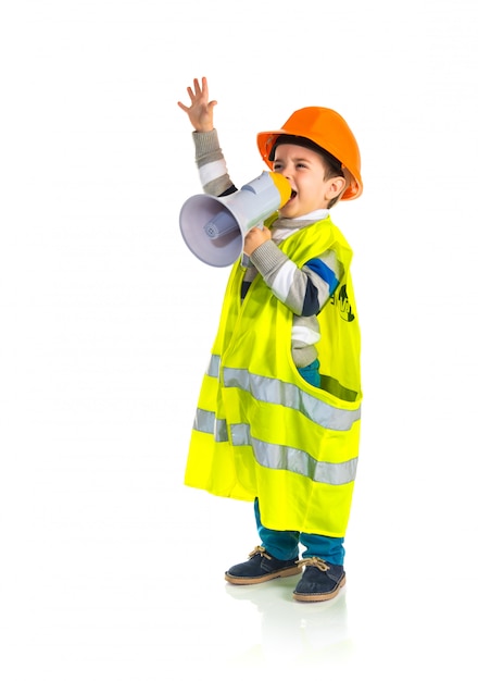 Kid dressed like workman shouting by megaphone