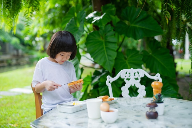 Kid eating food happy time breakfastxA