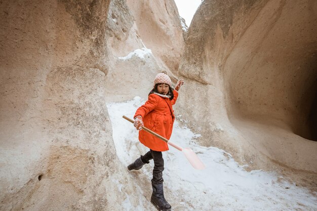 Kid enjoy playing in the cave of pasabag valley cappadocia