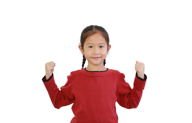 Kid gesture Strong. Asian little girl raising punch up isolated on white background.