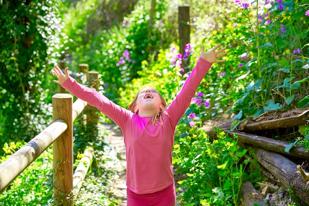 kid girl in spring track in Cuenca forest of Spain