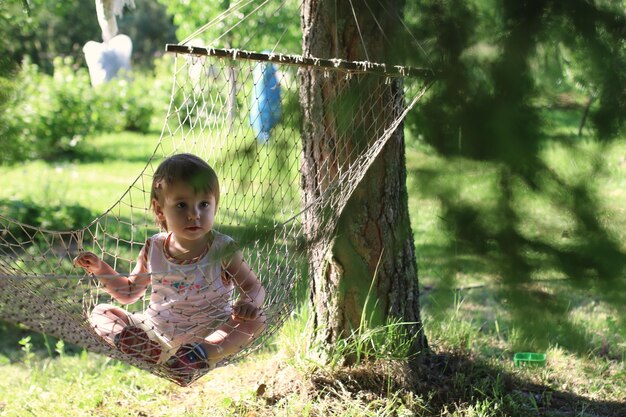 Kid in hammock on nature