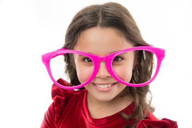 Kid happy wear cute eyeglasses accessory Child charming smile isolated white background Girl wear big funny eyeglasses for party Child cute face with eyeglasses close up Just want to have fun