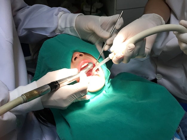 Kid having mouth checkup in dental clinic