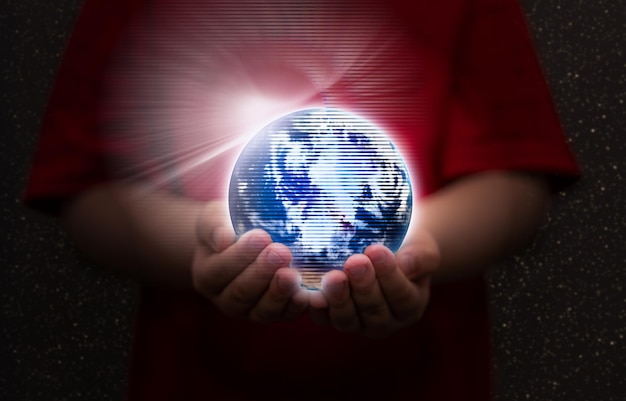 Kid hold global metaverse world hologram in hand for cyber online internet connect and family security for child concept