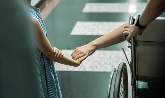 Kid hold hand send good feeling to patient 