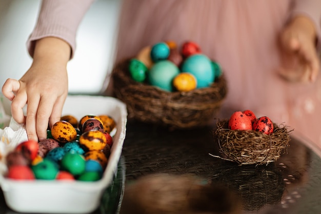 Kid holding Easter eggs