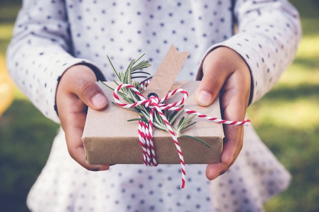 Kid holding eco gift box