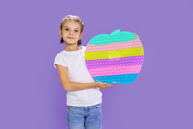 Kid holding huge apple anti stress bubble motor skills pop it fun child holding color popit fidget