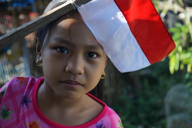 Photo kid and indonesian flag