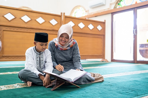 Kid learning to read Quran