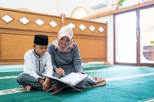 Kid learning to read Quran