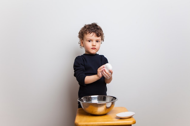 , the kid learns to wash his hands properly with soap