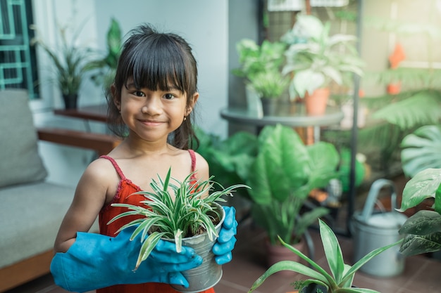 Kid planting and gardening at home