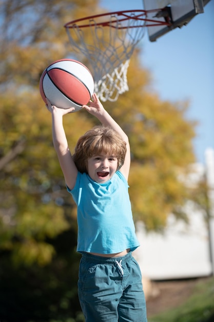 Kid playing basketball with basket ball active kids lifestyle