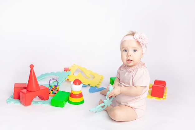 kid plays with cubes on a white isolated background