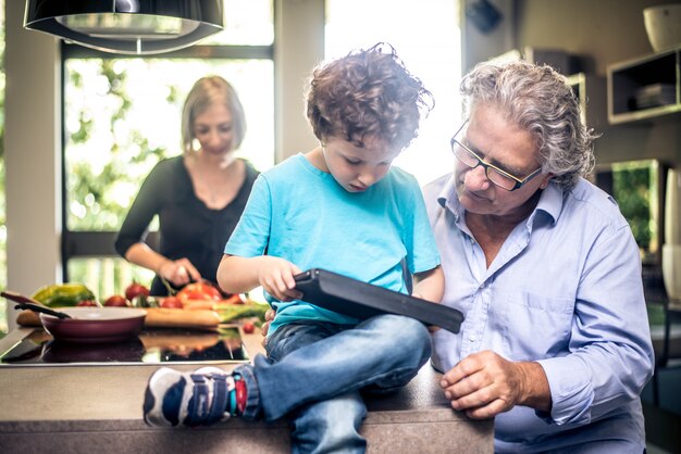 Kid plays with tablet