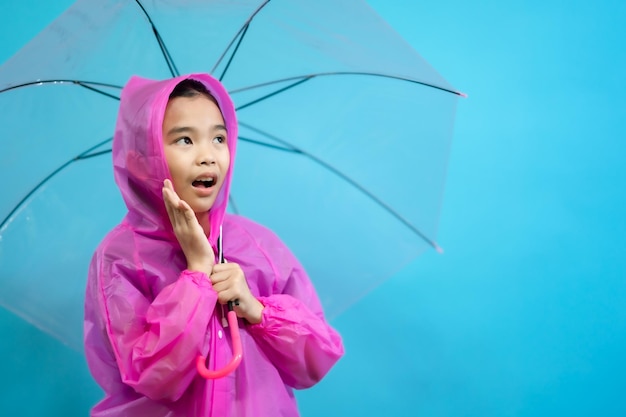 Kid smart and curious, children close up photo of cute and cheerful people, holding umbrella