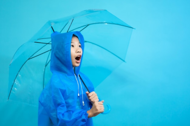 Kid smart and curious, children close up photo of cute and cheerful people, holding umbrella