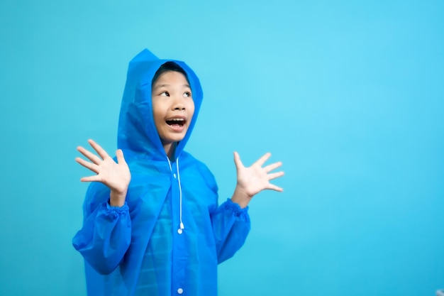 Kid smart and curious, children close up photo of cute and cheerful people, wearing rain coat