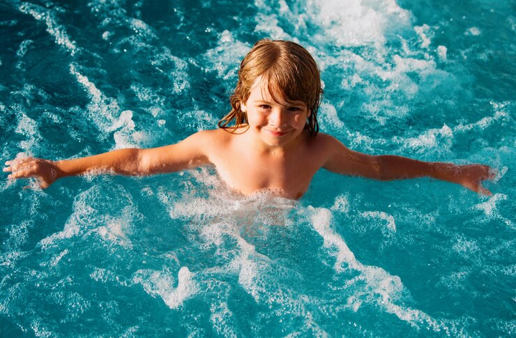 Kid swimming kids summer vacation in swimming pool