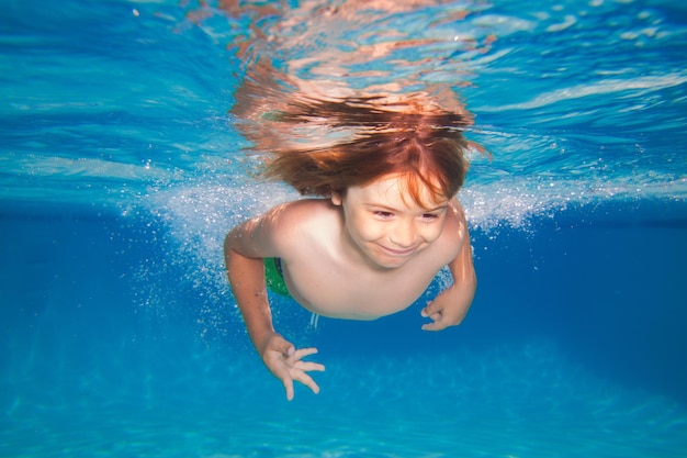 Kid swimming in pool underwater child boy swim under water in sea underwater children