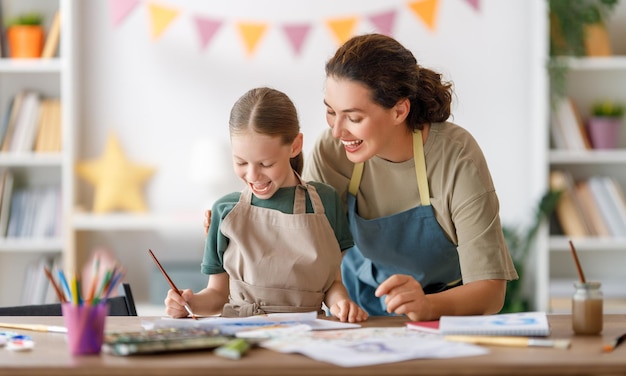 Kid and teacher at the art class