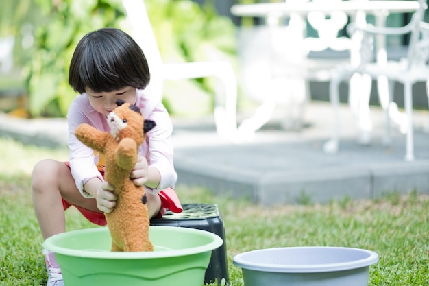 kid washing doll happy child