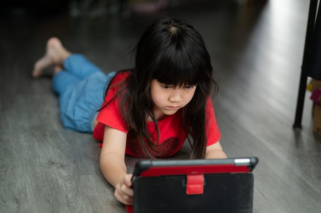 Kid watching tablet child addicted cartoon